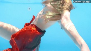 Petite teen Ivi Rein endures the free naked swimming