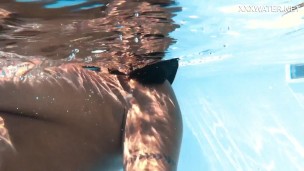 Yorgelis Carrillo, a famous pornstar, glides nude through the water
